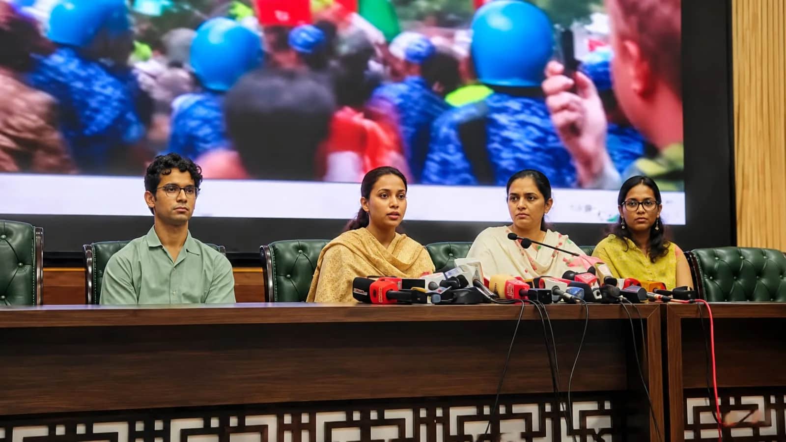 Family members of police personnel at the press conference